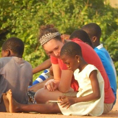 An intern reads with a child during her Social Work internship in Ghana A Projects Abroad intern gains social work experience in Ghana by working through activities with a child